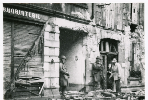 Soldiers and civilians in rubble in Bruyeres (ddr-densho-1007-40)