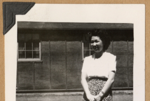 Young woman outside barracks (ddr-densho-542-242)
