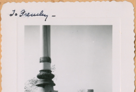 Woman standing in from of column. (ddr-densho-493-46)