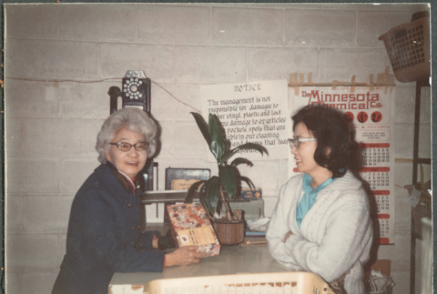 Two women at counter (ddr-densho-523-625)