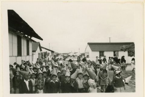 Children dressed up with cone-shaped hats (ddr-densho-37-1287)