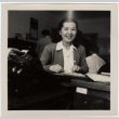 Woman seated at desk (ddr-densho-426-943)