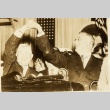 Franklin D. Roosevelt raising hands with another man (ddr-njpa-1-1522)