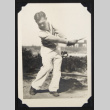 Man swinging a golf club (ddr-densho-542-722)