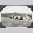 Men sitting outside row of tents (ddr-ajah-2-224)