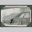 Large containers of fish docked at pier (ddr-densho-540-69)