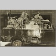 Soldiers climbing out of a truck bed (ddr-njpa-13-1406)