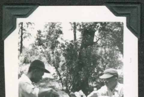 Two men at picnic table (ddr-densho-475-663)