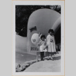 Susan and Leslie Shiomi by amusement ride (ddr-densho-522-584)