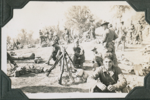 Men sitting on hillside (ddr-ajah-2-189)