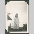 Woman outside a gas station (ddr-densho-463-141)