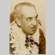 A man wearing leis (ddr-njpa-1-1315)