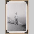 Man standing on a cliff (ddr-densho-542-356)