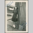 A young woman outside barracks (ddr-densho-298-91)