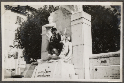 Man sitting on World War I memorial (ddr-densho-466-127)