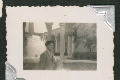 Young man in front of fountain (ddr-densho-550-226)