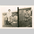 Split image. Family in front of fence outside barracks, child in front of fence (ddr-densho-430-181)