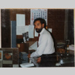 Man with beard standing by desk (ddr-densho-426-1347)