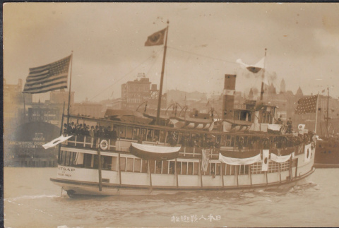 Boat with U.S. and Japanese flags (ddr-densho-355-639)