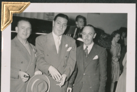 Three men in suits, holding hats (ddr-densho-434-126)