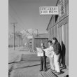 Japanese Americans in front of camp newspaper office (ddr-densho-93-2)