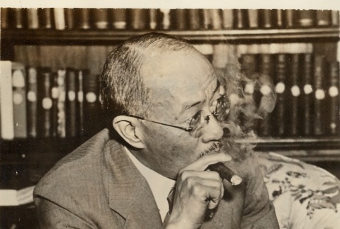 Wang Ching-ting smoking a cigar (ddr-njpa-1-1105)