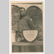 Person standing beside 442nd Infantry Regiment plaque (ddr-densho-1007-17)