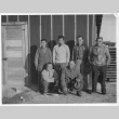 Japanese American men in front of barracks (ddr-densho-157-74)