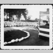 Crowd of people seated facing stage (ddr-densho-434-392)