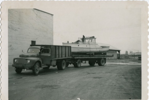 A truck towing a boat (ddr-densho-296-82)