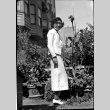 Martha (Nozawa) Tsuchida Suzuki standing in garden (ddr-densho-426-2176)