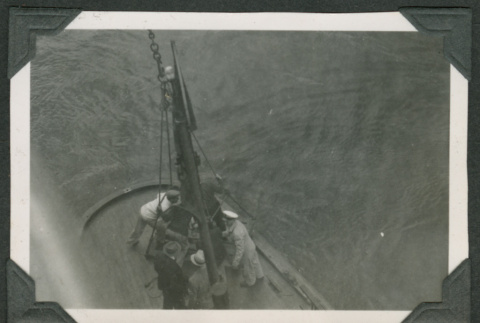 Men grouped on platform near water (ddr-densho-540-31)