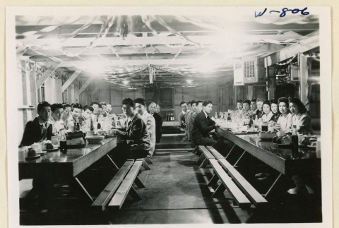 News Courier staff at dining tables (ddr-densho-37-1911)
