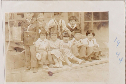 Nine children sitting on benches (ddr-densho-464-43)