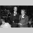 Tom accepting an award from Booth Gardner for the Kubota Gardening Company.  Amy Kubota also in the photo (ddr-densho-354-133)