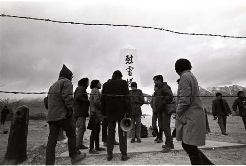 Pilgrims gathered in front of the Manzanar Cemetery Monument (ddr-manz-3-29)