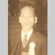 Man with a ribbon pinned to his chest (ddr-njpa-4-2381)