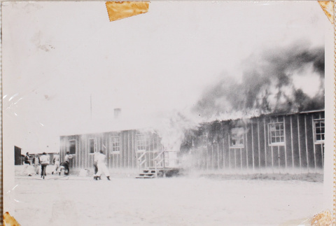 Men outside building on fire (ddr-densho-464-5)