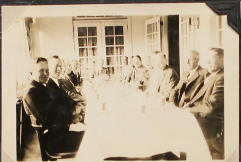 Group of men around a dining table (ddr-densho-259-25)