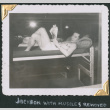 Man laying on bunk reading (ddr-densho-434-277)
