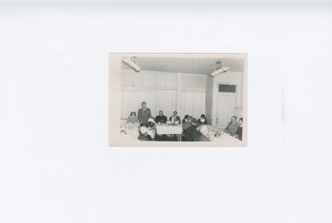 (Photograph) - Image of men and women sitting at tables (Front) (ddr-densho-330-281-master-1d32a2bfa4)