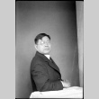 Portrait of man sitting at a table (ddr-densho-426-2003)