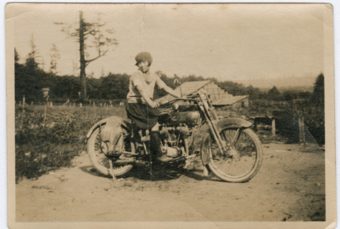 Japanese American woman on a motorcycle (ddr-densho-26-131)