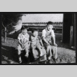 Three children sitting (ddr-densho-433-555)