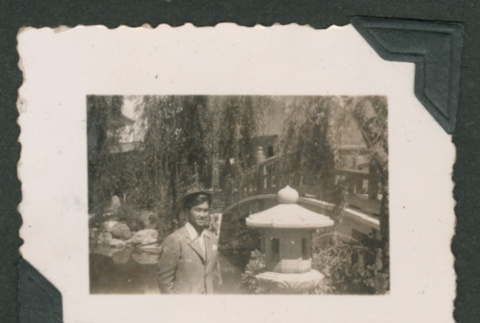 Young man in front of bridge (ddr-densho-550-231)