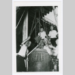 Men raising ancient bell (ddr-densho-1007-358)