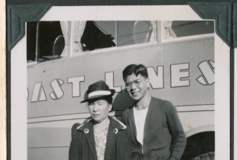 Photo of Tsutomu and Tsumu Fukuyama outside a bus (ddr-densho-483-936)