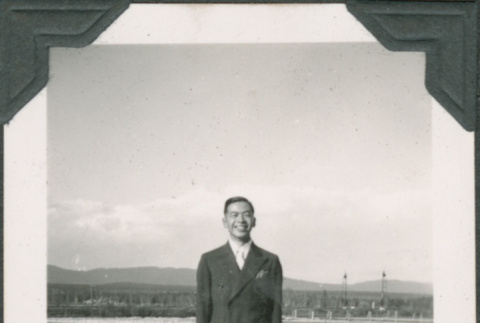 Noboru Sakahara standing in field (ddr-densho-316-334)