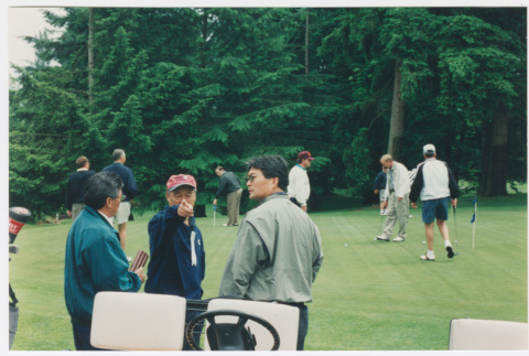 Participants at putting green at Densho Golf Tournament (ddr-densho-506-137)