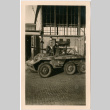Man sitting on armored jeep (ddr-densho-458-51)